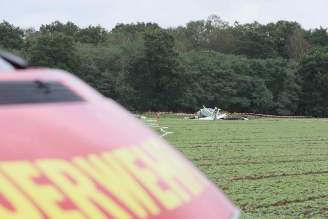 14 September 2026, North Rhine-Westphalia, Erkelenz: Amall plane lies in a field after it crashed, killing several people in the Rhineland. Photo: -/dpa