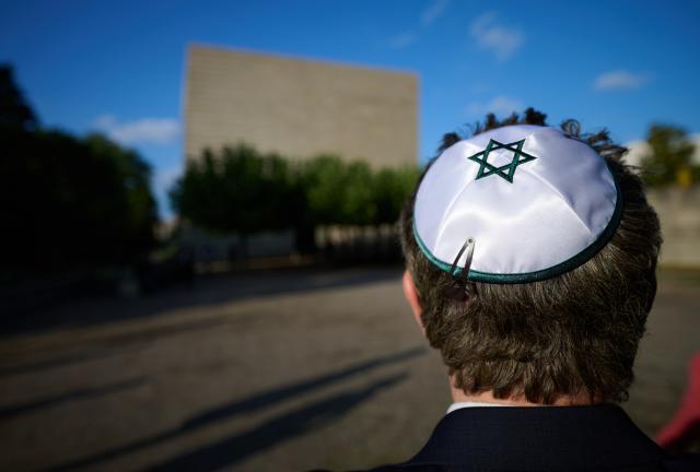 14 September 2026, Saxony, Dresden: A man wears a kippah with a Star of David during the reopening of the Dresden Synagogue ceremony. After years of construction, the Jewish community wants to celebrate its return to the synagogue with a festival. The construction work, which has been underway since January 2023, focused on improving structural and technical safety. Photo: Robert Michael/dpa