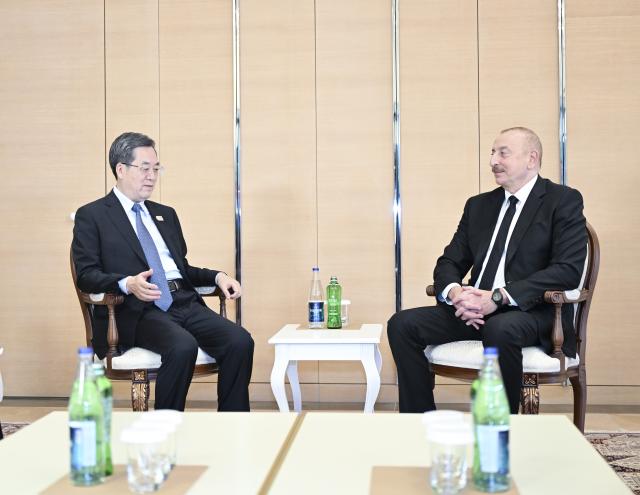 (241114) -- BAKU, Nov. 14, 2024 (Xinhua) -- Chinese Vice Premier Ding Xuexiang, also a member of the Standing Committee of the Political Bureau of the Communist Party of China Central Committee, meets with Azerbaijani President Ilham Aliyev in Baku, the capital city of Azerbaijan, Nov. 13, 2024. Ding met with Aliyev and held talks with Azerbaijani Deputy Prime Minister Shahin Mustafayev during his visit to Azerbaijan from Nov. 12 to 13. (Xinhua/Yan Yan)