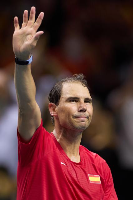 (241120) -- MALAGA, Nov. 20, 2024 (Xinhua) -- Rafael Nadal of Spain waves to the spectators after the quarterfinal between Spain and the Netherlands at Davis Cup Finals tennis tournament in Malaga, Spain, Nov. 19, 2024. The 22-time Grand Slam champion Rafael Nadal ended his career as Spain was eliminated by the Netherlands at the Davis Cup on Tuesday. (Xinhua/Meng Dingbo)