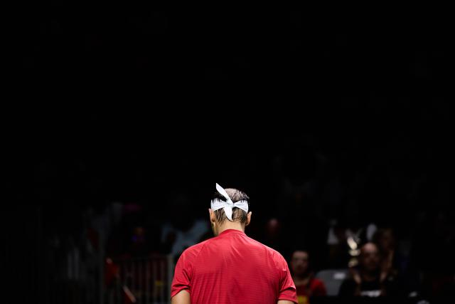 (241120) -- MALAGA, Nov. 20, 2024 (Xinhua) -- Rafael Nadal of Spain reacts while playing against Botic van de Zandschulp of the Netherlands during the quarterfinal between Spain and the Netherlands at Davis Cup Finals tennis tournament in Malaga, Spain, Nov. 19, 2024. The 22-time Grand Slam champion Rafael Nadal ended his career as Spain was eliminated by the Netherlands at the Davis Cup on Tuesday. (Xinhua/Meng Dingbo)