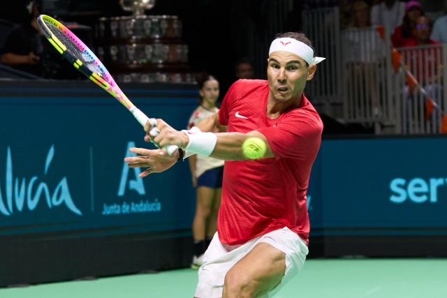 (241120) -- MALAGA, Nov. 20, 2024 (Xinhua) -- Rafael Nadal of Spain returns the ball to Botic van de Zandschulp of the Netherlands during the quarterfinal between Spain and the Netherlands at Davis Cup Finals tennis tournament in Malaga, Spain, Nov. 19, 2024. The 22-time Grand Slam champion Rafael Nadal ended his career as Spain was eliminated by the Netherlands at the Davis Cup on Tuesday. (Xinhua/Meng Dingbo)