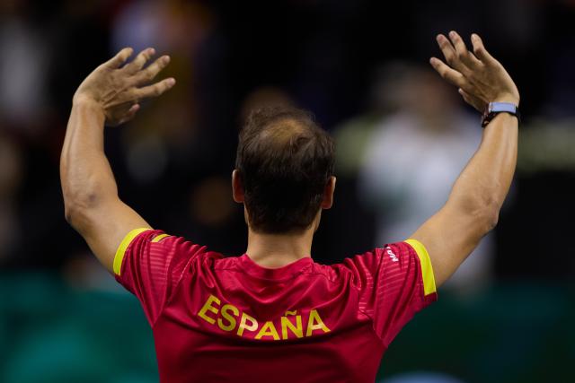 (241120) -- MALAGA, Nov. 20, 2024 (Xinhua) -- Rafael Nadal of Spain waves to the spectators during a tribute to his career after the quarterfinal between Spain and the Netherlands at Davis Cup Finals tennis tournament in Malaga, Spain, Nov. 19, 2024. The 22-time Grand Slam champion Rafael Nadal ended his career as Spain was eliminated by the Netherlands at the Davis Cup on Tuesday. (Xinhua/Meng Dingbo)