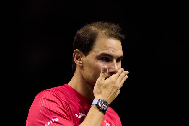 (241120) -- MALAGA, Nov. 20, 2024 (Xinhua) -- Rafael Nadal of Spain reacts during a tribute to his career after the quarterfinal between Spain and the Netherlands at Davis Cup Finals tennis tournament in Malaga, Spain, Nov. 19, 2024. The 22-time Grand Slam champion Rafael Nadal ended his career as Spain was eliminated by the Netherlands at the Davis Cup on Tuesday. (Xinhua/Meng Dingbo)