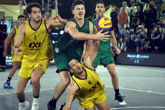 (241124) -- HONG KONG, Nov. 24, 2024 (Xinhua) -- Worthy De Jong (bottom) of Amsterdam vies for the ball during the final match between Amsterdam of the the Netherlands and Paris of France at the International Basketball Federation (FIBA) 3x3 World Tour Hong Kong Final 2024 in Hong Kong, south China, Nov. 24, 2024. (Photo by Lo Ping Fai/Xinhua)