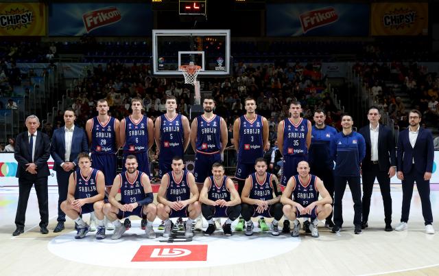 (241125) -- BELGRAD, Nov. 25, 2024 (Xinhua) -- Team members of Serbia pose prior to the Group G match between Serbia and Denmark at the FIBA EuroBasket 2025 Qualifiers in Belgrade, Serbia, on Nov. 24, 2024. (Photo by Predrag Milosavljevic/Xinhua)