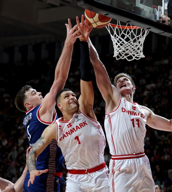 (241125) -- BELGRAD, Nov. 25, 2024 (Xinhua) -- Serbia's Balsa Koprivica (L) vies with Denmark's Iffe Lundberg (C) and Mads Bonde Sturup during the Group G match between Serbia and Denmark at the FIBA EuroBasket 2025 Qualifiers in Belgrade, Serbia, on Nov. 24, 2024. (Photo by Predrag Milosavljevic/Xinhua)