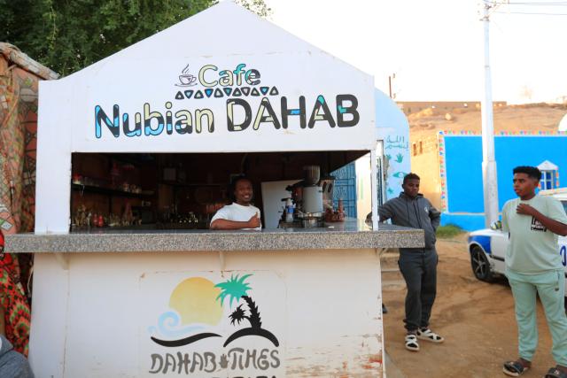 (241125) -- CAIRO, Nov. 25, 2024 (Xinhua) -- Nubians enjoy leisure time at a cafe at the Nubian village of Gharb Sohail in Aswan, Egypt, Nov. 24, 2024.
  Gharb Sohail, a Nubian village lying along the west bank of Nile, is a popular tourist destination in Aswan where visitors have the chance to know Nubian's unique cultures, traditions, crafts and food. (Xinhua/Sui Xiankai)