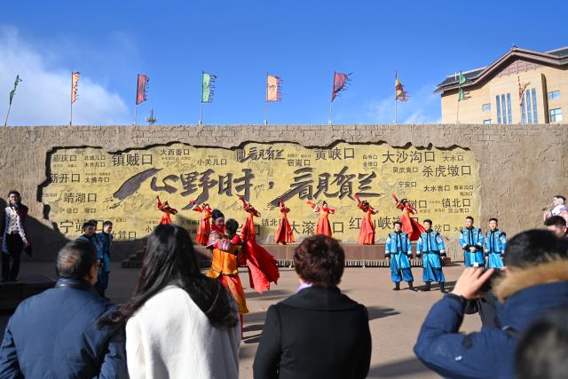 (241126) -- YINCHUAN, Nov. 26, 2024 (Xinhua) -- A performance is staged to welcome tourists at an immersive performing arts town in Xixia District of Yinchuan, northwest China's Ningxia Hui Autonomous Region, Nov. 25, 2024.
  The immersive performing arts town, also called Manpu Town, is a tourism resort attracting people with its unique Helan Mountain culture. (Xinhua/Mao Zhu)