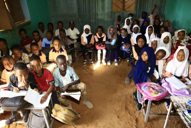 (241126) -- OMDURMAN, Nov. 26, 2024 (Xinhua) -- Children attend a class at a school in Al-Iskan, north of Omdurman, Sudan, on Nov. 25, 2024. More than 15 million children in Sudan are out of school due to the country's ongoing conflict. In relatively safe areas of Omdurman, some schools resumed classes on Monday. (Photo by Mohamed Khidir/Xinhua)