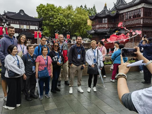 (241201) -- BEIJING, Dec. 1, 2024 (Xinhua) -- This photo taken with a mobile phone shows international tourists posing for photos at Yuyuan Garden in east China's Shanghai, April 28, 2024. (Xinhua/Chen Aiping)