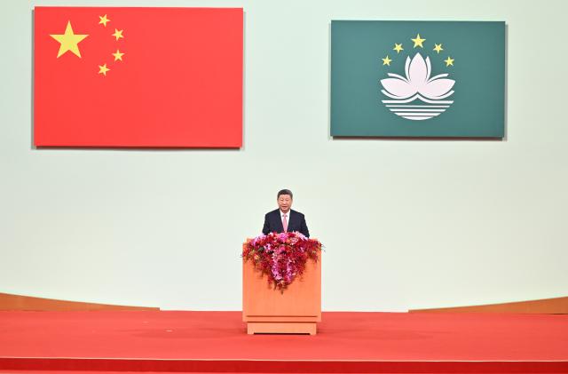 (241220) -- MACAO, Dec. 20, 2024 (Xinhua) -- Chinese President Xi Jinping, also general secretary of the Communist Party of China Central Committee and chairman of the Central Military Commission, delivers a speech at a meeting celebrating the 25th anniversary of Macao's return to the motherland and the inaugural ceremony of the sixth-term government of the Macao Special Administrative Region (SAR), at the Macao East Asian Games Dome in Macao, south China, Dec. 20, 2024. (Xinhua/Yue Yuewei)