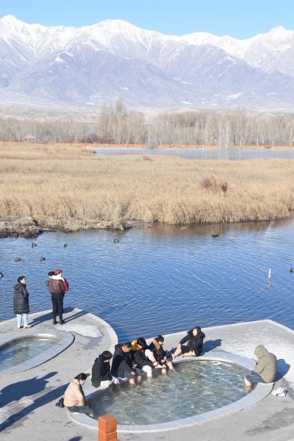 (241221) -- WENQUAN, Dec. 21, 2024 (Xinhua) -- This photo taken on Nov. 28, 2024 shows a natural hot spring in Wenquan County, northwest China's Xinjiang Uygur Autonomous Region. TO GO WITH "Wondrous Xinjiang: Hot springs spread warmth among locals, tourists" (Xinhua/Zhang Xiaolong)