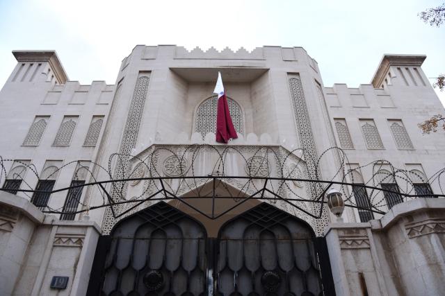 (241221) -- DAMASCUS, Dec. 21, 2024 (Xinhua) -- Qatari flag is seen hoisted at the Qatari embassy in Damascus, Syria, Dec. 21, 2024. Qatar officially reopened its embassy in the Syrian capital Damascus on Saturday, raising its national flag over the building for the first time in 13 years. (Photo by Monsef Memari/Xinhua)