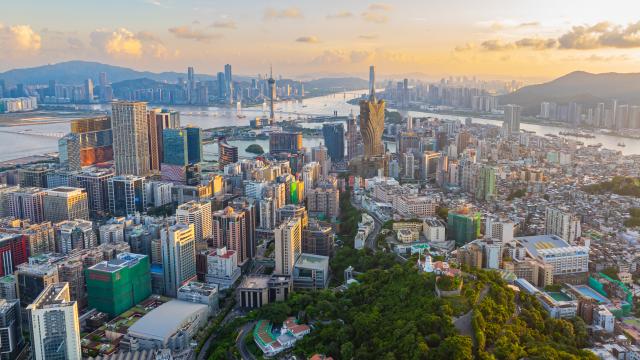 (241222) -- GUANGZHOU, Dec. 22, 2024 (Xinhua) -- An aerial drone photo taken on July 8, 2024 shows a view of Macao, Hengqin and Zhuhai in south China. (Xinhua/Cheong Kam Ka)