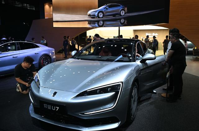 (241222) -- GUANGZHOU, Dec. 22, 2024 (Xinhua) -- This photo shows a Yangwang U7 of BYD at the 22nd Guangzhou International Automobile Exhibition at the China Import and Export Fair Complex in Guangzhou, south China's Guangdong Province, Nov. 15, 2024. (Xinhua/Deng Hua)