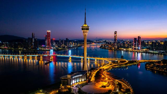 (241222) -- GUANGZHOU, Dec. 22, 2024 (Xinhua) -- An aerial drone photo taken on July 5, 2024 shows a view of Macao Tower, and Hengqin in Zhuhai City of Guangdong Province, south China. (Xinhua/Cheong Kam Ka)