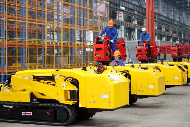 (241229) -- BEIJING, Dec. 29, 2024 (Xinhua) -- Workers assemble lightweight crawler-driven electrical tower building machines at a smart factory of Zhejiang Construction Engineering Group in Leidian Town of Deqing County, east China's Zhejiang Province, Dec. 12, 2024.
  Top 10 China news events of 2024
  8. Decisive deployment of a package of incremental policies to boost economic recovery
  On Sept. 26, the Political Bureau of the CPC Central Committee held a meeting to analyze and study the current economic situation, announcing the decisive deployment of a package of incremental policies.
  The Chinese economy has posted a generally stable performance this year while facing intensified external pressures and increasing domestic challenges. Over the past year, China has enhanced counter-cyclical adjustments through fiscal and monetary policies, stabilized the real estate market, boosted the capital market, and assisted enterprises in overcoming difficulties.
  The country's total grain output surpassed 700 billion kilograms for the first time this year, and people's well-being has been improved. Risks in key areas have been addressed in an orderly and effective manner.
  China's economic, technological and comprehensive national strengths have continued to grow, and this year's main economic and social development goals and tasks have been accomplished. (Photo by Xie Shangguo/Xinhua)