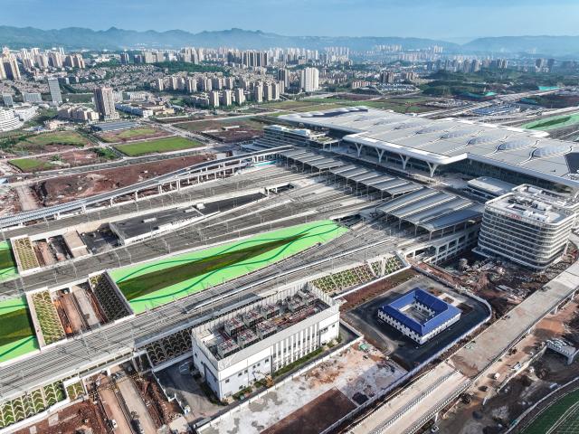(250509) -- CHONGQING, May 9, 2025 (Xinhua) -- An aerial drone photo shows the high-speed test train departing from Chongqing East Railway Station in southwest China's Chongqing Municipality, May 9, 2025. With the departure of the high-speed test train from Chongqing East Railway Station, the joint debugging and test of Chongqing section of the newly-built Chongqing-Xiamen high-speed railway were successfully completed and started its test operation on Friday. (Xinhua/Tang Yi)
