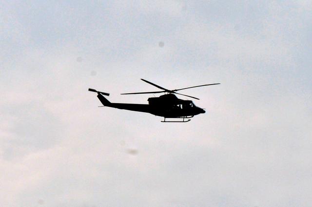 (250509) -- POLONNARUWA, May 9, 2025 (Xinhua) -- A helicopter flies to Polonnaruwa to take part in rescue operations after a helicopter crash in Sri Lanka, April 9, 2025. Six military personnel succumbed to their injuries after a Sri Lankan Air Force helicopter crashed into the Maduru Oya Reservoir in the country's North Central Province on Friday morning, said a spokesperson. (Photo by Gayan Sameera/Xinhua)