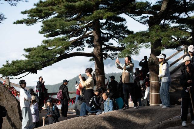 (250509) -- HUANGSHAN, May 9, 2025 (Xinhua) -- Tourists visit the Huangshan Scenic Area in east China's Anhui Province, on April 23, 2025. Huangshan Mountain is a listed UNESCO World Cultural and Natural Heritage Site, which has attracted a large number of tourists.
  To minimize the impact of visitors on its vegetation growth, the Huangshan Scenic Area rotates days off for its major scenic spots, as a special arrangement for ecological protection.
   The Tiandu Peak, one of the most popular sites in the Huangshan scenic area, ended its more than five-year "vacation" and resumed opening to the public on May 20, 2024. While the Lianhua Peak, the highest peak of Huangshan Mountain, has been so far closed for more than a year. (Xinhua/Zhang Duan)