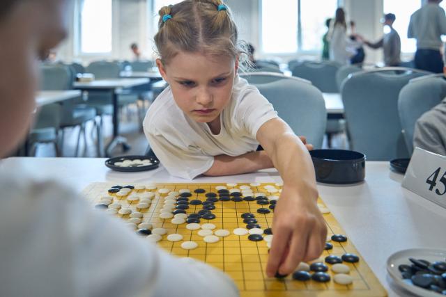 (250510) -- VLADIVOSTOK, May 10, 2025 (Xinhua) -- A young player competes during the 4th Far East Cup Go Tournament at Vladivostok, Russia, May 10, 2025. (Photo by Guo Feizhou/Xinhua)