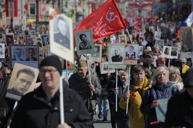 (250510) -- ST. PETERSBURG, May 10, 2025 (Xinhua) -- People participate in the "Immortal Regiment" parade with photos of veterans in hands to commemorate the 80th anniversary of the victory in the Soviet Union's Great Patriotic War in St. Petersburg, Russia, May 9, 2025. (Photo by Irina Motina/Xinhua)