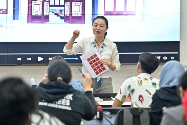 (250510) -- BAOTOU, May 10, 2025 (Xinhua) -- A teacher instructs Chinese calligraphy to students from University of Malaysia Sarawak (UNIMAS) at Vocational and Technical College of Inner Mongolia Agricultural University in Baotou, north China's Inner Mongolia Autonomous Region, May 9, 2025.
  A total of 21 UNIMAS students on Friday attended here hands-on studio workshops featuring traditional Chinese culture and technical training. (Xinhua/Ma Jinrui)