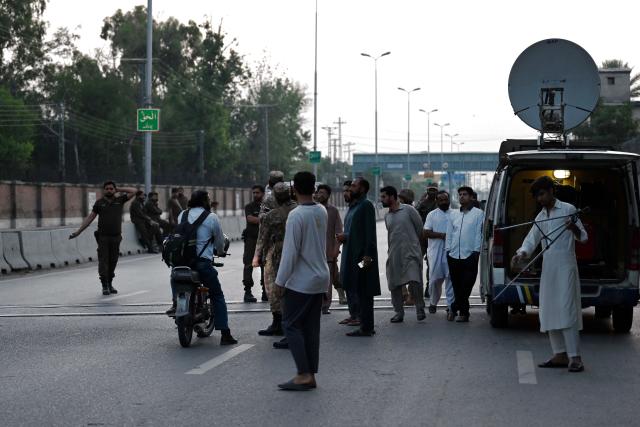 (250510) -- RAWALPINDI, May 10, 2025 (Xinhua) -- Security personnel stop people on a road leading to Nur Khan Air Base following Indian missile strike in Rawalpindi, Pakistan, May 10, 2025.
  India launched missile and drone strikes in multiple areas of Pakistan, including three airbases of the Pakistan Air Force (PAF), and also resorted to unprovoked firing along the international border in eastern Punjab province, Pakistani officials and sources confirmed in the wee hours of Saturday. (Xinhua/Ahmad Kamal)
