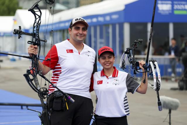 (250510) -- SHANGHAI, May 10, 2025 (Xinhua) -- Batuhan Akcaoglu (L) and Hazal Burun of Türkiye pose after the gold final of the Compound Mixed Team competition at Shanghai 2025 Archery World Cup Stage 2 in Shanghai, China, May 10, 2025. (Xinhua/Wang Xiang)