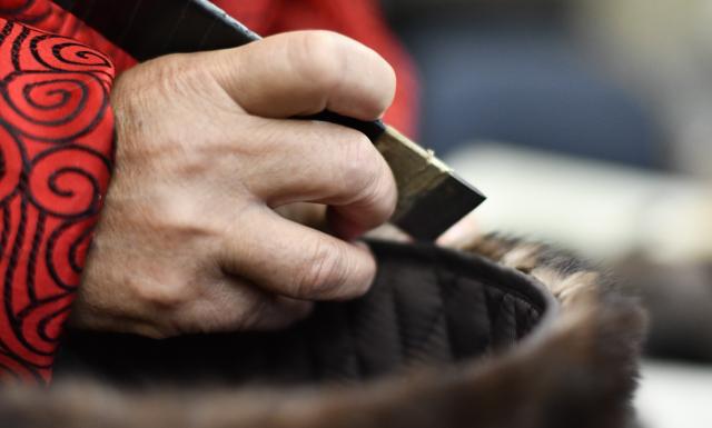 (250510) -- BEIJING, May 10, 2025 (Xinhua) -- Li Jinshan, an inheritor of Shengxifu hat making technique, checks the quality of a hat in Beijing, capital of China, April 22, 2025.
  Shengxifu, one of Beijing's time-honored brands, was established in 1911 and remains popular among people owing to its outstanding skills and premium quality. Its hat making technique was listed as a national intangible cultural heritage in 2008.
  Hat making of Shengxifu requires painstaking efforts, ranging from hide picking and material matching, to fur tailoring and leather flattening. Each procedure is demanding and must be done by hand.
  To better balance ancient craftsmanship and modern creativity, the brand continues imbibing new technologies, equipment and designs, keeping the traditional workmanship running along with the fashion. (Xinhua/Li Xin)