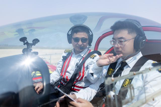 (250510) -- SHENYANG, May 10, 2025 (Xinhua) -- A trainee (R) attends a light sport aircraft flight training session at Liaoning Zhongzhi Yisheng Aviation Flight Academy in Faku County, in Shenyang, northeast China's Liaoning Province, April 26, 2025.
  As an important driving force of new economic momentum, the low-altitude economy is viewed by many as a key strategic emerging industry.
   In recent years, Liaoning Province has seized opportunities to actively develop its low-altitude economy. Taking full advantage of its location and its strengths in the fields of aviation and aerospace, the province has focused its development of the low-altitude economy on the general aviation and drone sectors, and enriched application scenarios such as emergency rescue, sightseeing tourism, and agricultural and forestry protection.
   A development pattern featuring Shenyang and Dalian as key forces supporting Liaoning's low-altitude economy is taking shape, ranging from China's home-grown four-seat electric aircraft RX4E, independently developed by the Liaoning General Aviation Academy of Shenyang Aerospace University, securing the first type certificate, to a drone powered by an ultra-low-temperature high-energy-density lithium battery, developed by the Dalian Institute of Chemical Physics under the Chinese Academy of Sciences, completing a flight test under extreme cold conditions. 
   The Shenyang general aviation industry base has attracted a cluster of enterprises, and multiple low-altitude passenger routes have been launched in Dalian. The low-altitude economy has injected impetus into the high-quality development of Liaoning Province. (Xinhua/Chu Jiayin)