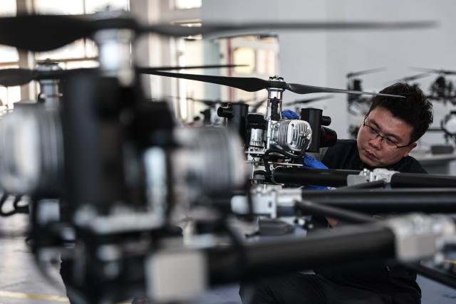 (250510) -- SHENYANG, May 10, 2025 (Xinhua) -- An engineer of Optimal Aerospace Science and Industry Group Co., Ltd. checks a drone for emergency and firefighting operations in Shenbei New District of Shenyang, northeast China's Liaoning Province, April 25, 2025.
  As an important driving force of new economic momentum, the low-altitude economy is viewed by many as a key strategic emerging industry.
   In recent years, Liaoning Province has seized opportunities to actively develop its low-altitude economy. Taking full advantage of its location and its strengths in the fields of aviation and aerospace, the province has focused its development of the low-altitude economy on the general aviation and drone sectors, and enriched application scenarios such as emergency rescue, sightseeing tourism, and agricultural and forestry protection.
   A development pattern featuring Shenyang and Dalian as key forces supporting Liaoning's low-altitude economy is taking shape, ranging from China's home-grown four-seat electric aircraft RX4E, independently developed by the Liaoning General Aviation Academy of Shenyang Aerospace University, securing the first type certificate, to a drone powered by an ultra-low-temperature high-energy-density lithium battery, developed by the Dalian Institute of Chemical Physics under the Chinese Academy of Sciences, completing a flight test under extreme cold conditions. 
   The Shenyang general aviation industry base has attracted a cluster of enterprises, and multiple low-altitude passenger routes have been launched in Dalian. The low-altitude economy has injected impetus into the high-quality development of Liaoning Province. (Xinhua/Pan Yulong)