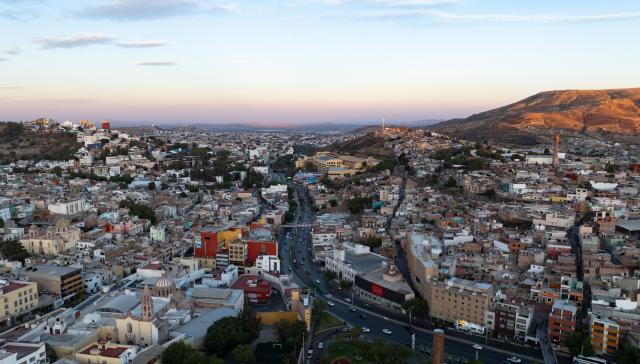 (250510) -- ZACATECAS, May 10, 2025 (Xinhua) -- An aerial drone photo taken on May 6, 2025 shows the city view of Zacatecas, state of Zacatecas, Mexico. Once a major silver mining region in Latin America, Zacatecas had promoted the city's historical prosperity with its mineral wealth. As resources exhausted, the city shifted its focus on culture and tourism by preserving its rich colonial architecture and mining heritage, including the historic city center, recognized as a UNESCO World Cultural Heritage Site, and the iconic El Eden Mine, and drawing numerous tourists from around the world. (Xinhua/Li Mengxin)