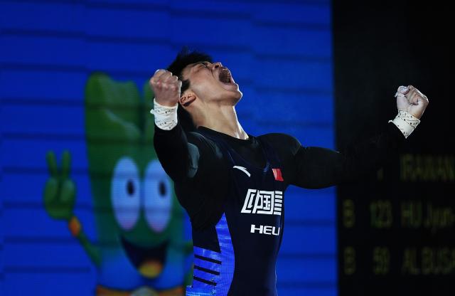(250510) -- JIANGSHAN, May 10, 2025 (Xinhua) -- Zheng Xinhao of China reacts during the men's 67kg competition at 2025 Asian Weightlifting Championships in Jiangshan, east China's Zhejiang Province, May 10, 2025. (Xinhua/Hou Zhaokang)