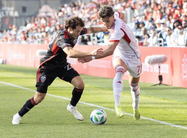 (250511) -- TORONTO, May 11, 2025 (Xinhua) -- Theo Corbeanu (R) of Toronto FC vies with Aaron Herrera of D.C. United during the 2025 Major League Soccer (MLS) regular season match between Toronto FC and D.C. United at BMO Field in Toronto, Canada, May 10, 2025. (Photo by Zou Zheng/Xinhua)