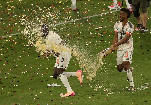 (250511) -- MUNICH, May 11, 2025 (Xinhua) -- Bayern Munich's Kingsley Coman (R) celebrate winning the Bundesliga title with Dayot Upamecano after the German first division Bundesliga football match between Bayern Munich and Borussia Moenchengladbach in Munich, Germany, May 10, 2025. (Photo by Philippe Ruiz/Xinhua)