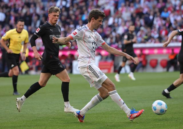 (250511) -- MUNICH, May 11, 2025 (Xinhua) -- Bayern Munich's Thomas Mueller (R) competes during the German first division Bundesliga football match between Bayern Munich and Borussia Moenchengladbach in Munich, Germany, May 10, 2025. (Photo by Philippe Ruiz/Xinhua)