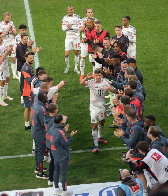 (250511) -- MUNICH, May 11, 2025 (Xinhua) -- Bayern Munich's Thomas Mueller (C) gestures to his teammates before being substituted during the German first division Bundesliga football match between Bayern Munich and Borussia Moenchengladbach in Munich, Germany, May 10, 2025. (Photo by Philippe Ruiz/Xinhua)