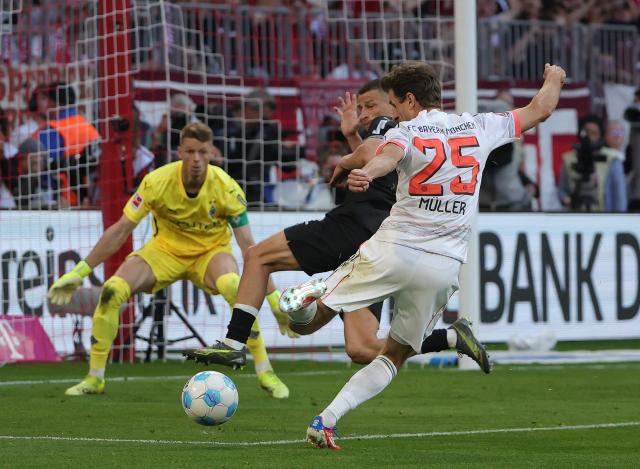 (250511) -- MUNICH, May 11, 2025 (Xinhua) -- Bayern Munich's Thomas Mueller (front) shoots during the German first division Bundesliga football match between Bayern Munich and Borussia Moenchengladbach in Munich, Germany, May 10, 2025. (Photo by Philippe Ruiz/Xinhua)