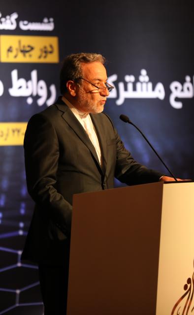 (250511) -- DOHA, May 11, 2025 (Xinhua) -- Iranian Foreign Minister Seyed Abbas Araghchi speaks during the fourth Arab-Iranian Dialogue Conference in Doha, Qatar, May 10, 2025. Iran will not back down on its nuclear rights in the negotiations with the United States, Iranian Foreign Minister Seyed Abbas Araghchi said on Saturday, one day ahead of their fourth round of the indirect talks in Oman. (Xinhua)