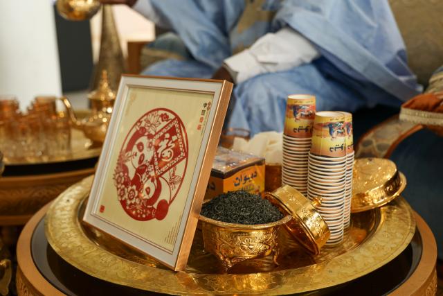 (250511) -- RABAT, May 11, 2025 (Xinhua) -- A piece of Chinese paper-cutting work is pictured at a stand for Moroccan tea art demonstration during "Tea for Harmony: Yaji Cultural Salon," in Rabat, Morocco, May 9, 2025. A culture and tourism promotion event of east China's Jiangxi Province was held here Friday to showcase the elegance and flavor of the Chinese tea and the cultural charm of Jiangxi to the Moroccan public. (Xinhua/Huo Jing)