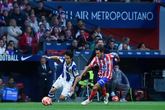 (250511) -- MADRID, May 11, 2025 (Xinhua) -- Koke (R) of Atletico de Madrid vies with Takefusa Kubo of Real Sociedad during the LaLiga football match between Atletico de Madrid and Real Sociedad in Madrid, Spain, on May 10, 2025. (Photo by Gustavo Valiente/Xinhua)