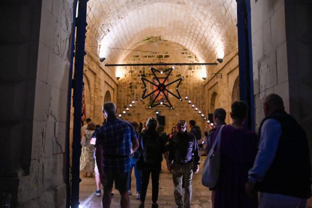 (250511) -- BIRGU, May 11, 2025 (Xinhua) -- People visit a museum illuminated with light of candles in Birgu, Malta, on May 10, 2025. Heritage Malta, in collaboration with the Birgu Local Council, on Saturday hosted the "Museums by Candlelight" event. (Photo by Jonathan Borg/Xinhua)