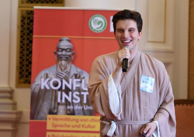 (250511) -- GRAZ, May 11, 2025 (Xinhua) -- A contestant delivers a speech during the 24th "Chinese Bridge" Chinese Proficiency Competition for College Students in Graz, Austria, May 10, 2025. The Austrian division finals of the 24th "Chinese Bridge" Chinese Proficiency Competition for College Students was held on Saturday in Graz. (Xinhua/He Canling)
