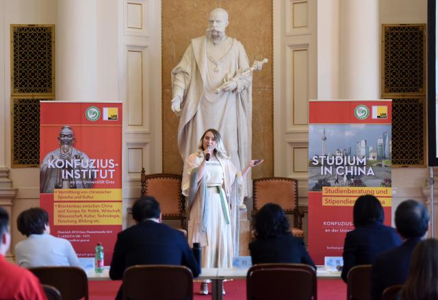 (250511) -- GRAZ, May 11, 2025 (Xinhua) -- A contestant delivers a speech during the 24th "Chinese Bridge" Chinese Proficiency Competition for College Students in Graz, Austria, May 10, 2025. The Austrian division finals of the 24th "Chinese Bridge" Chinese Proficiency Competition for College Students was held on Saturday in Graz. (Xinhua/He Canling)