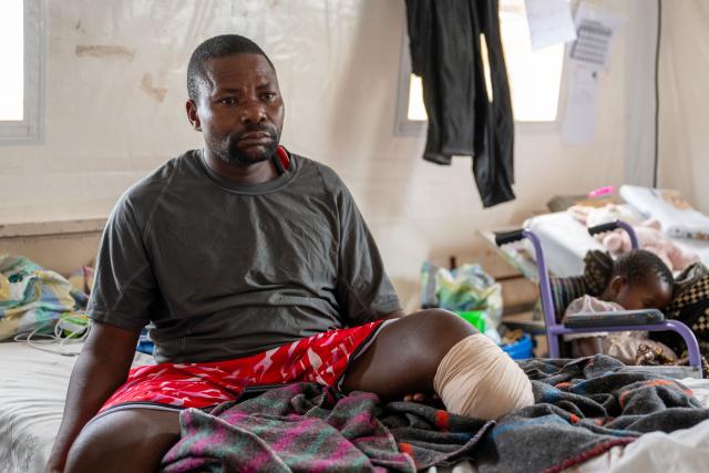 (250511) -- GOMA, May 11, 2025 (Xinhua) -- A father who lost his left leg in the local conflict rests beside his sleeping daughter at Ndosho Hospital in Goma, the Democratic Republic of the Congo (DRC), on May 10, 2025. Ndosho Hospital, located in Goma, the capital city of North Kivu province in the eastern DRC, has built temporary tents in its parking lot to relieve pressure and increased its bed capacity to approximately 130, as the security situation in the eastern DRC has deteriorated in recent years. (Xinhua/Zheng Yangzi)