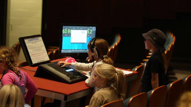 (250511) -- CANBERRA, May 11, 2025 (Xinhua) -- A young girl operates a lighting console, experiencing the work of a lighting technician, during an open day event of the Canberra Theater Center in Canberra, Australia, on May 10, 2025. The Canberra Theater Center opened its doors to the public on Saturday as part of its 60th anniversary celebrations. (Photo by Zhang Na/Xinhua)