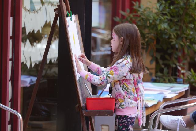 (250511) -- CANBERRA, May 11, 2025 (Xinhua) -- A girl draws a picture at the activity area during an open day event of the Canberra Theater Center in Canberra, Australia, on May 10, 2025. The Canberra Theater Center opened its doors to the public on Saturday as part of its 60th anniversary celebrations. (Photo by Zhang Na/Xinhua)