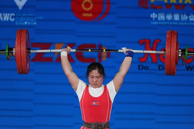 (250511) -- JIANGSHAN, May 11, 2025 (Xinhua) -- Kim Il Gyong of the Democratic People's Republic of Korea (DPRK) competes during the women's 59kg competition at 2025 Asian Weightlifting Championships in Jiangshan, east China's Zhejiang Province, May 11, 2025. (Xinhua/Hou Zhaokang)